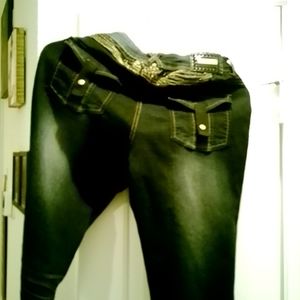 Rocawear women jeans, dark denim with gold trim. Size 11